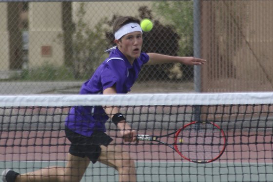 Lemoore's Spencer Denney volleys against Hanford West in a Thursday match. The talented Tiger won his match as Lemoore rolled to a 9-0 win.